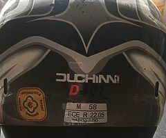 Selling a motorbike helmet no longer use few scrapes and marks on it but do some1 starting off size 