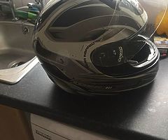 Selling a motorbike helmet no longer use few scrapes and marks on it but do some1 starting off size 