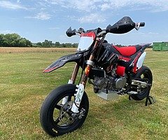 R a f f l e for brand new 140 supermoto