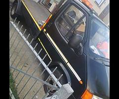 Smiley face ford Transit Recovery truck