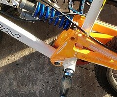 Downhill mountain bike in good condition not being used lying in a shed