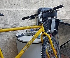 Yellow Scott mountain bike with locker