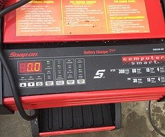 Snap on battery charger