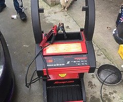 Snap on battery charger