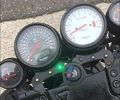 Selling a 2004 triumph Streetfighter with an R1 tail.