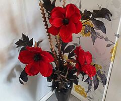 Red and black flowers and vase