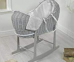 Grey wicker pod Moses basket.