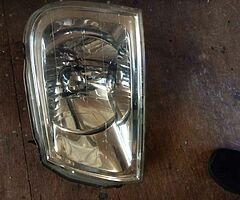 Mitsubishi L200 passenger side headlight