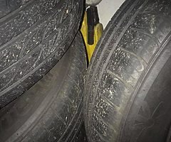 Four steel wheels from a 2011 Vauxhall Astra
