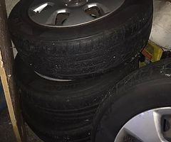 Four steel wheels from a 2011 Vauxhall Astra