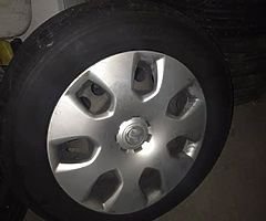 Four steel wheels from a 2011 Vauxhall Astra