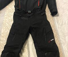 Alpinestars motorcycle waterproof jacket and Alpinestars motorcycle waterproof trousers.