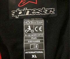 Alpinestars motorcycle waterproof jacket and Alpinestars motorcycle waterproof trousers.