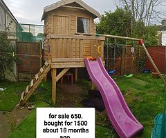 Tree house with attached swings