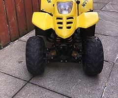 125 quad with reveres