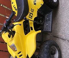 125 quad with reveres