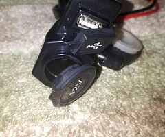 Motorcycle handlebar mounted phone charger