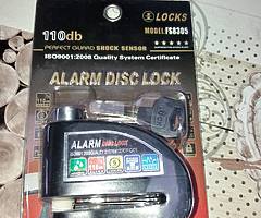 Motorbike disc lock with alarm