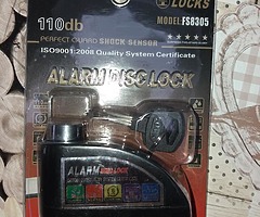 Motorbike disc lock with alarm
