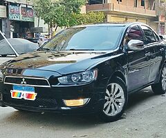 ميتسوبيشى لانسر شارك ٢٠١٣ الفئه الثانيه ماشيه ١٢٥ الف رخصه سنه ونص فابريكا انا اول مالك