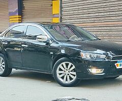 ميتسوبيشى لانسر شارك ٢٠١٣ الفئه الثانيه ماشيه ١٢٥ الف رخصه سنه ونص فابريكا انا اول مالك