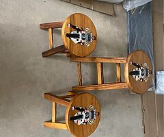 “Teak wooden chairs