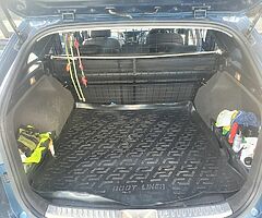 Boot grill stop your dog climbing over your seats.