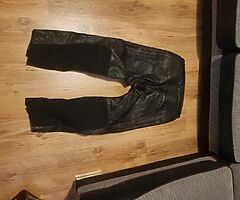 2 pairs leather motorcycle bottoms.