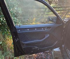 Black BMW e46 doors, more parts