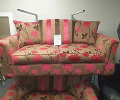 3 and 2 seater sofa in a tan and pink fabric LITERALLY IN NEW CONDITION