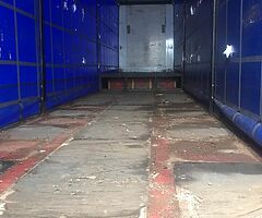 Step frame curtain sided trailer