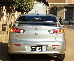 ميتسوبيشى لانسر شارك ٢٠١٥ خليجى فابريكا كامله مثبت سرعه وايرباج وطاره مالتى وشاشة عرض - Image 4/10