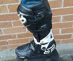 Variety of motocross equipment.
Boots, helmet,chest protector and neck brace.