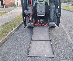 Manual wheelchair ramp