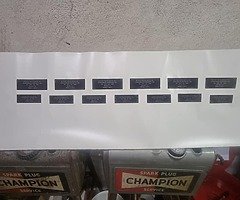 Champion spark plug units and various new parts for restoration - Image 6/9