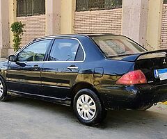 لانسر بومه ٢٠٠٨ اوتوماتيك خليجى كامله رخصه سنه باسمى مرور الدقى عداد ١٧٥ الف - Image 5/10