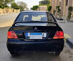 لانسر بومه ٢٠٠٨ اوتوماتيك خليجى كامله رخصه سنه باسمى مرور الدقى عداد ١٧٥ الف - Image 6/10