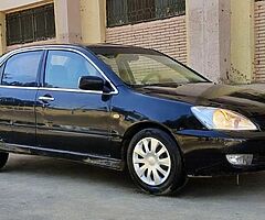 لانسر بومه ٢٠٠٨ اوتوماتيك خليجى كامله رخصه سنه باسمى مرور الدقى عداد ١٧٥ الف - Image 7/10