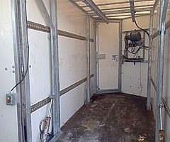 Mobile hydraulic lift for butchers animals can be seen working