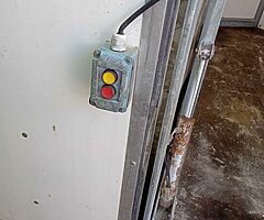Mobile hydraulic lift for butchers animals can be seen working
