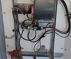 Mobile hydraulic lift for butchers animals can be seen working