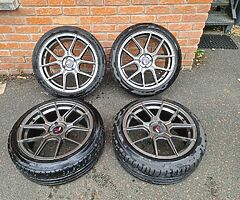 Japan Racing JR30 17 Inch 4x100 Alloy Wheels + Bridgestone 205 45 17 Tyres & Spigot Rings