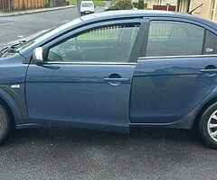 2011 Mitsubishi Lancer Base triam