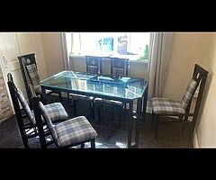Very heavy glass table and chairs 5 foot by 31 inches cost 500 new sell for €200 ono