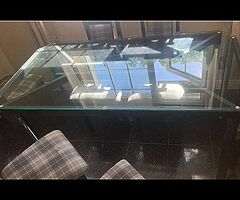 Very heavy glass table and chairs 5 foot by 31 inches cost 500 new sell for €200 ono