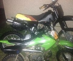 2 bikes going the beat blue 1 needs throttle cable