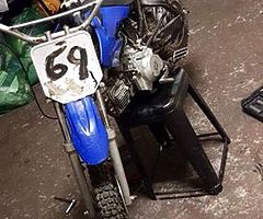 2 bikes going the beat blue 1 needs throttle cable